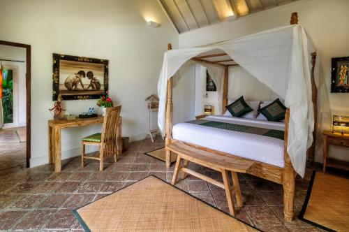 Кровать или кровати в номере Hevea Villas