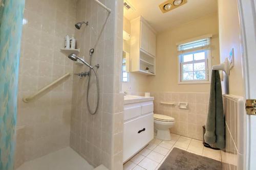 a bathroom with a shower and a toilet at Spacious family oasis in silicon beach 5mins to LAX in Los Angeles