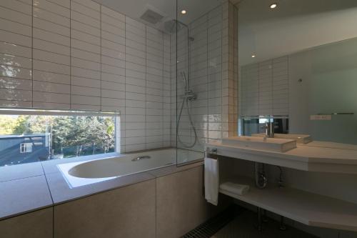 Kylpyhuone majoituspaikassa Millesime - operated by H2 Life