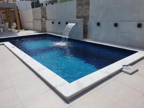 Der Swimmingpool an oder in der Nähe von Linda Casa de Praia com piscina, área verde - MOBILIADA à 150 m do mar em Tamandaré-PE