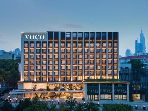 a building with a vogo sign on top of it at voco Nanjing Oriental Pearl in Nanjing