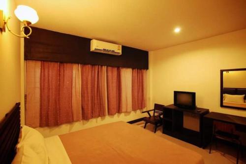 Cama o camas de una habitación en ไทยโฮเต็ล