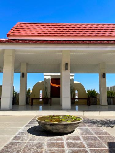 a large bowl of water in front of a building at The Empire Nimman in Chiang Mai