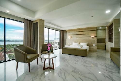 Ένα ή περισσότερα κρεβάτια σε δωμάτιο στο Sunrise Aventus Hotel Nusa Dua