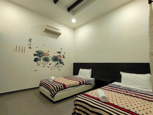 Ένα ή περισσότερα κρεβάτια σε δωμάτιο στο Jawa Townstay