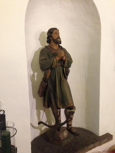 a statue of a man holding a bow at Gasthaus Sonne in Tarrenz