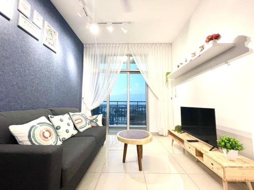 a living room with a couch and a tv at SKS Habitat 2BR by Luxecocoo CK Johor Bahru Larkin in Johor Bahru