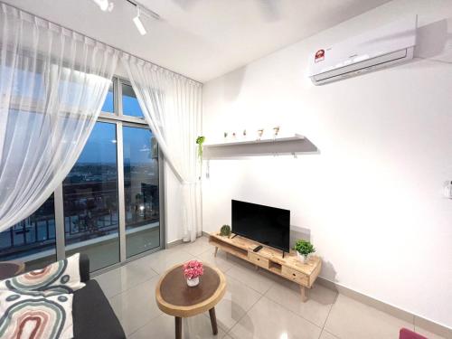a living room with a television and a large window at SKS Habitat 2BR by Luxecocoo CK Johor Bahru Larkin in Johor Bahru