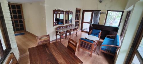 an overhead view of a living room with a piano at The Woods in Nainital