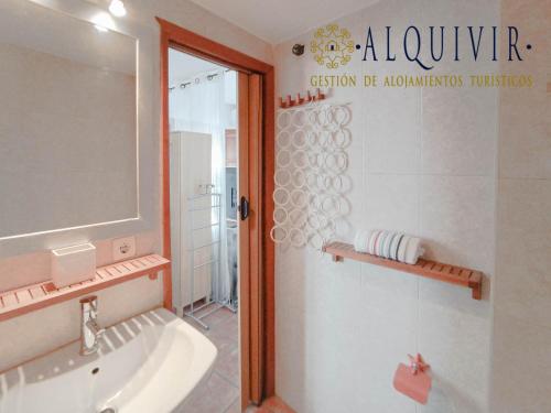 a bathroom with a tub and a sink and a shower at Apartamento Ilusión Andaluza in Córdoba