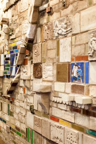 a brick wall with pictures on it at Elite Plaza Hotel Malmö in Malmö