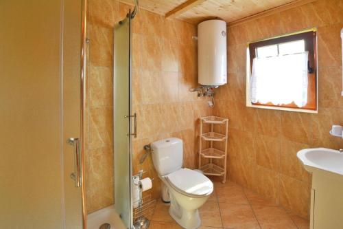 a bathroom with a toilet and a sink at Holiday Home in Jaros awiec near Beach & Cliff in Jarosławiec