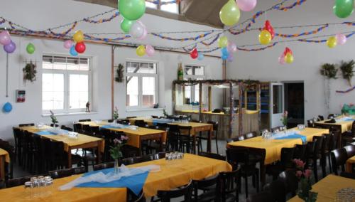 a banquet hall with tables and balloons on the ceilings at Relax pension Schonwald in Budišov nad Budišovkou