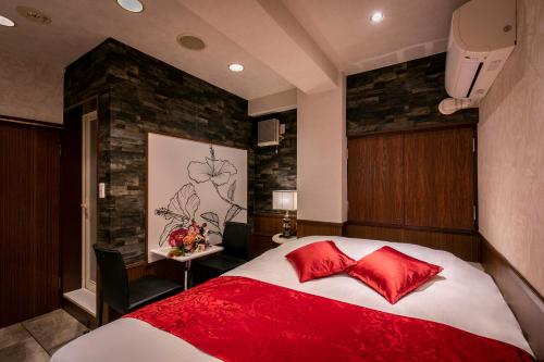 Postel nebo postele na pokoji v ubytování Hotel EXE アネックス 大人専用
