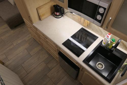 an overhead view of a kitchen with a stove at Apartamenty u Łukasza in Zakopane