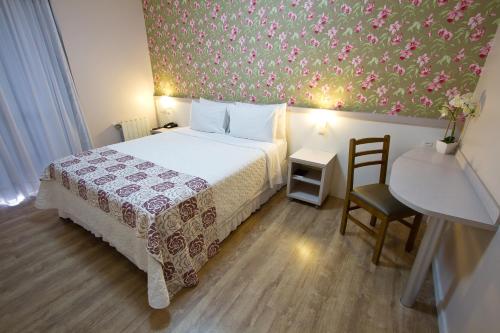Een bed of bedden in een kamer bij Gaboardi Park Hotel