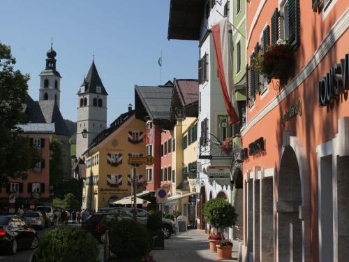 a street in a town with buildings and a church at Chalet in Kirchberg near Ski Slopes in Kirchdorf in Tirol
