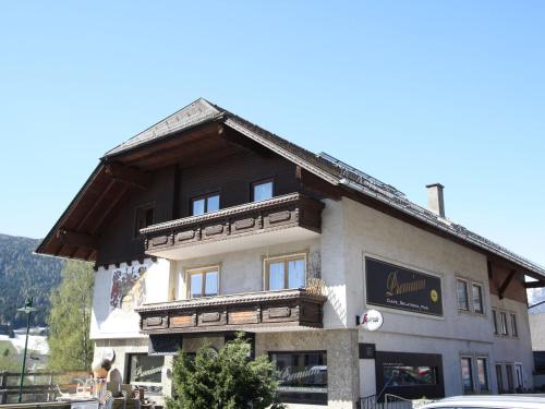 a large building with a wooden roof at Apartment near the ski area in Sankt Michael im Lungau