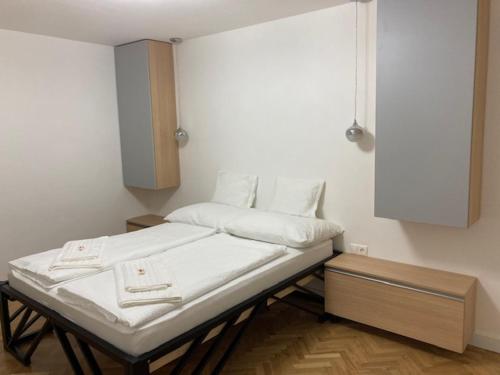 a hospital room with a bed and a cabinet at WBR. vendégház in Villány