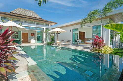 an image of a swimming pool in a villa at Shambhala Grand Villa - Private Pool Villas by Escape Villas - Top Choice - Guest Favorite - Best Location in Bang Tao Beach