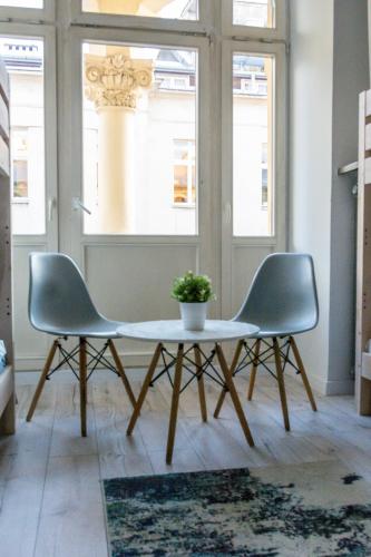 a table and two chairs in a room at Moon Hostel Warszawa in Warsaw
