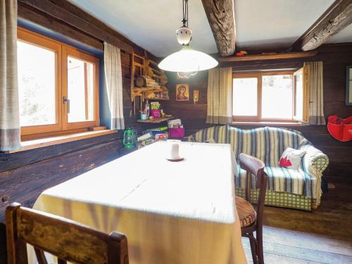a dining room with a table and two chairs at Spacious Alpine Hut in Bad Kleinkirchheim with Garden in Bad Kleinkirchheim