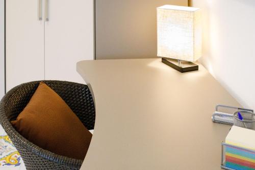 a table with a lamp on top of it at YourHome - Relais Il Sogno di Positano in Positano