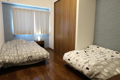 Tempat tidur dalam kamar di AP YOURS　Hotel４０１