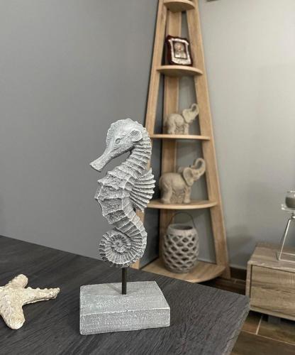 a statue of a seahorse in front of a shelf at House of Sunset - Tranquility - View - Relaxation in Sívas