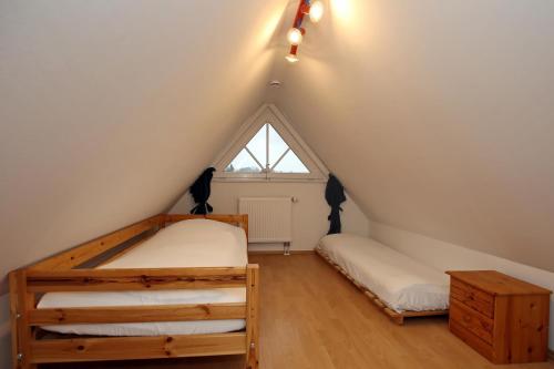 Ein Bett oder Betten in einem Zimmer der Unterkunft Ferienhaus Am Fulgenbach
