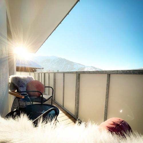 a balcony with a view of a snowy mountain at PAM Apartments in Kaprun