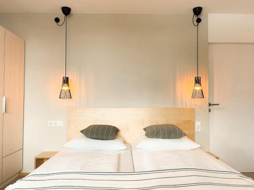 Postel nebo postele na pokoji v ubytování PAM Apartments