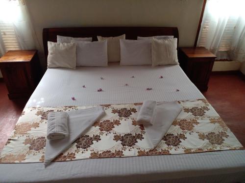 Ένα ή περισσότερα κρεβάτια σε δωμάτιο στο 4ty two Homestay Galle