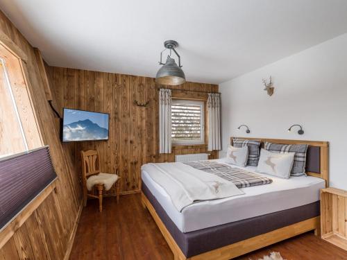Letto o letti in una camera di Narzenhof Wellness Chalets, Familien & Luxus Apartments am Bauernhof