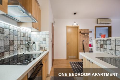 a kitchen with a sink and a counter top at BpR City Lodge Apartments in Budapest