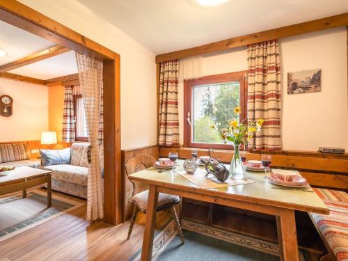 a living room with a table and a couch at Holiday home in Bad St Leonhard in Carinthia in Bad Sankt Leonhard im Lavanttal