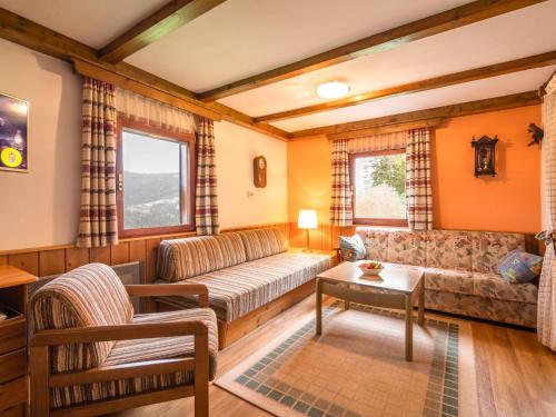 a living room with a couch and a table at Holiday home in Bad St Leonhard in Carinthia in Bad Sankt Leonhard im Lavanttal