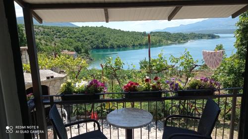 a balcony with a view of a river at Holiday home Marija in Vrlika