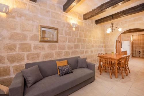 a living room with a couch and a table at Casa Melita in Rabat
