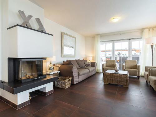 A seating area at Luxurious chalet with sauna in Mauterndorf