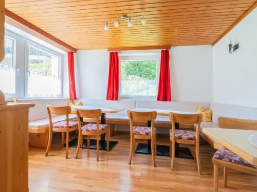 a dining room with a table and chairs at Holiday home in Wenns Piller with 3 terraces in Piller