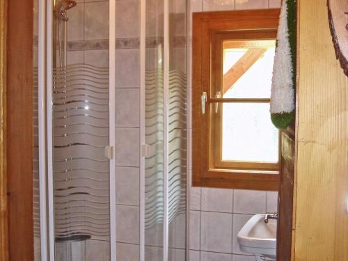 a bathroom with a shower and a sink at Inviting Chalet in Kolbnitz Teuchl with Garden and Terrace in Penk