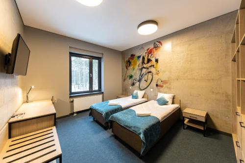 Postel nebo postele na pokoji v ubytování Stadium Hotel