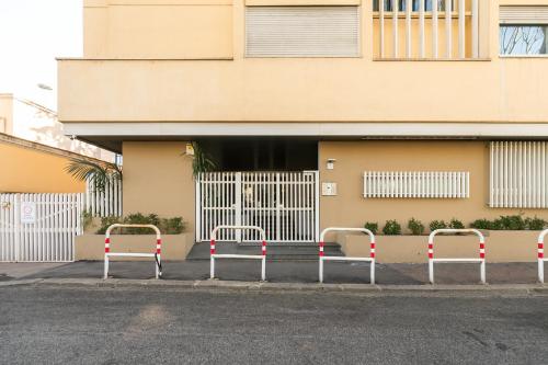 a row of metal barricades in front of a building at R.C. Giulio Cesare. Loft in centro in Rome