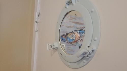 a reflection of a person in a toilet mirror at seemoi in Norderney