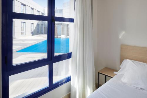 Postel nebo postele na pokoji v ubytování Iraipe Logroño Hotel