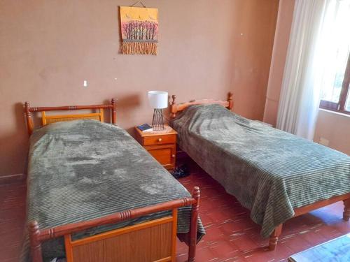 Ein Bett oder Betten in einem Zimmer der Unterkunft Depto Grande con terraza, la mejor ubicación