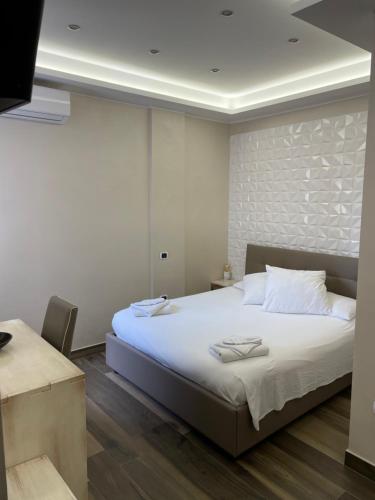 Postel nebo postele na pokoji v ubytování B&B Il Duomo