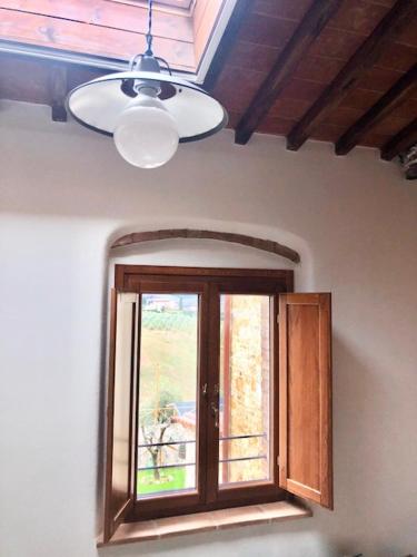 a window in a room with a ceiling at Laura Chianti Vacanze in Poggibonsi
