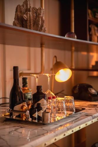 a shelf with bottles and glasses on a table at The Dean Galway in Galway